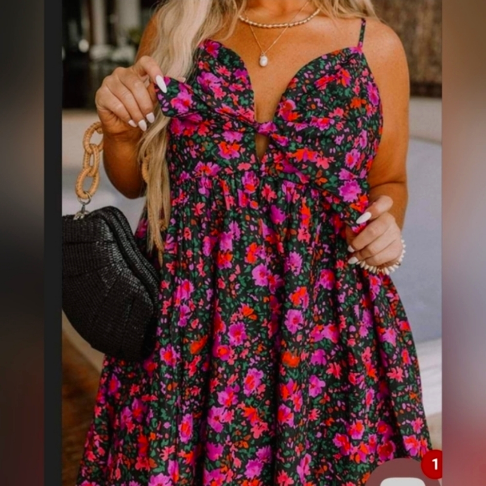 This dress is a little bit of fun and a little bit of oo-la-la. Floral dress.